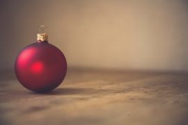 Up close picture of a Christmas ornament on the floor | Child Loss | Grief during the holidays | Pregnancy Loss | Evolve Counseling | Centennial CO 80112